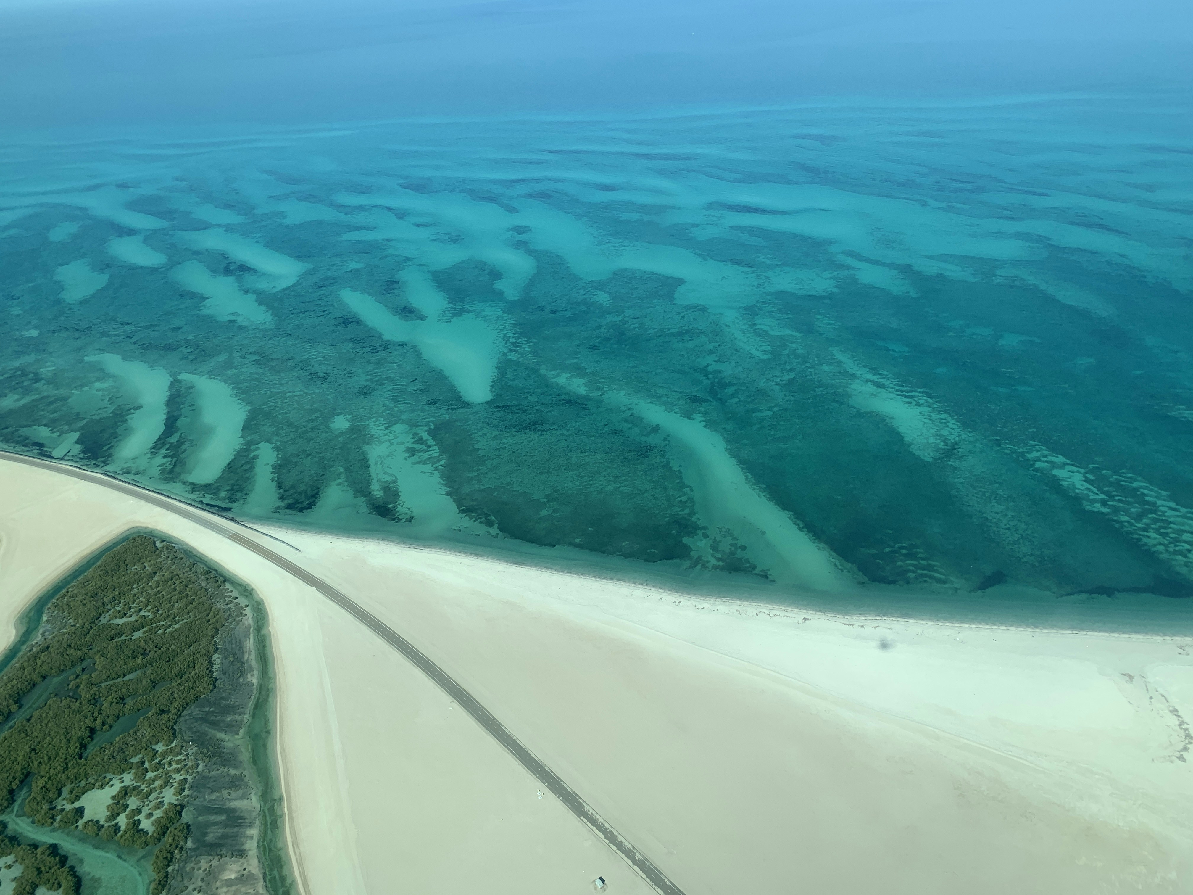 Aerial view of turquoise waters and sandy beaches